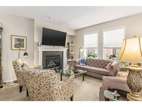 3102-14645 6 Street Sw, Calgary, AB - Indoor Photo Showing Living Room With Fireplace