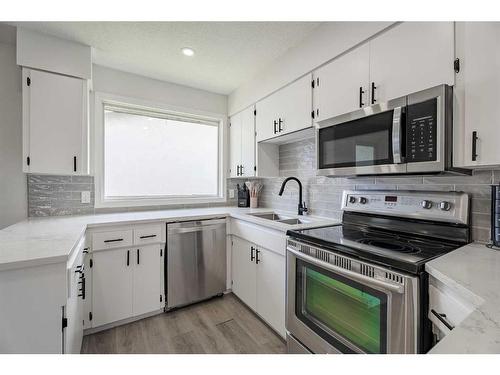 3412 33 Street Se, Calgary, AB - Indoor Photo Showing Kitchen With Stainless Steel Kitchen With Double Sink