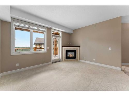 2418-2330 Fish Creek Boulevard Sw, Calgary, AB - Indoor Photo Showing Other Room With Fireplace