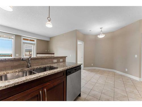 2418-2330 Fish Creek Boulevard Sw, Calgary, AB - Indoor Photo Showing Kitchen With Double Sink