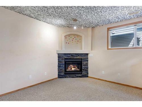 34 Covehaven Rise Ne, Calgary, AB - Indoor Photo Showing Living Room With Fireplace