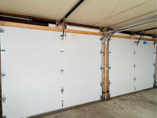 908 Hunterston Road Nw, Calgary, AB - Indoor Photo Showing Garage