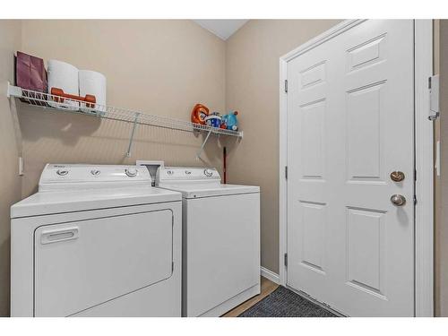 91 Evercreek Bluffs Place Sw, Calgary, AB - Indoor Photo Showing Laundry Room