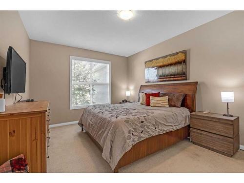 91 Evercreek Bluffs Place Sw, Calgary, AB - Indoor Photo Showing Bedroom
