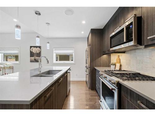 1-1724 Kensington Road Nw, Calgary, AB - Indoor Photo Showing Kitchen With Double Sink With Upgraded Kitchen