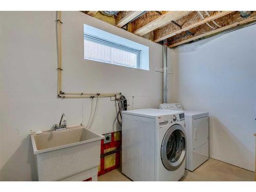 81 Bridlewood Manor Sw, Calgary, AB - Indoor Photo Showing Laundry Room