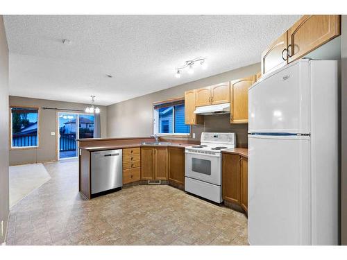 8 Everridge Road Sw, Calgary, AB - Indoor Photo Showing Kitchen With Double Sink