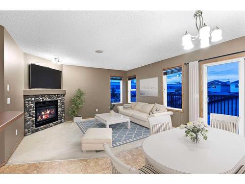 8 Everridge Road Sw, Calgary, AB - Indoor Photo Showing Other Room With Fireplace