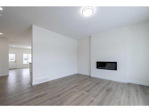 376 Heartland Way, Cochrane, AB - Indoor Photo Showing Living Room With Fireplace