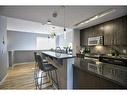 203-180 9 Street Ne, Calgary, AB  - Indoor Photo Showing Kitchen With Upgraded Kitchen 