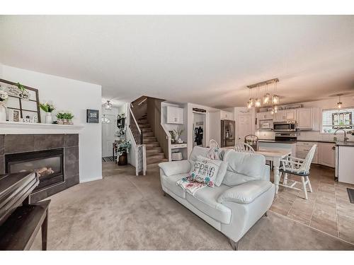 242 Shannon Square Sw, Calgary, AB - Indoor Photo Showing Living Room With Fireplace