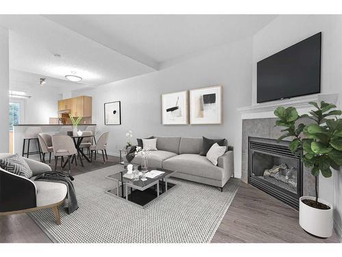 210-527 15 Avenue Sw, Calgary, AB - Indoor Photo Showing Living Room With Fireplace