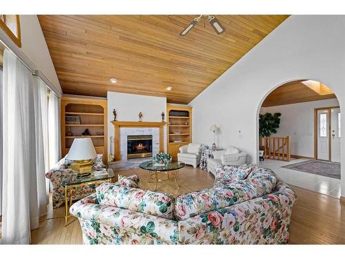 54 Hamilton Drive, Rural Rocky View County, AB - Indoor Photo Showing Living Room With Fireplace