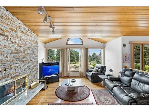 54 Hamilton Drive, Rural Rocky View County, AB - Indoor Photo Showing Living Room With Fireplace