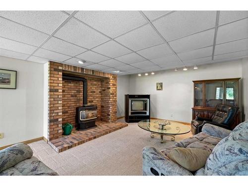 54 Hamilton Drive, Rural Rocky View County, AB - Indoor Photo Showing Living Room With Fireplace