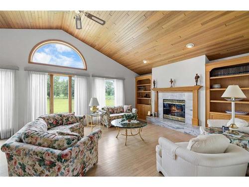 54 Hamilton Drive, Rural Rocky View County, AB - Indoor Photo Showing Living Room With Fireplace