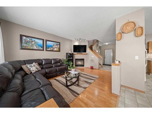 10748 Hidden Valley Drive Nw, Calgary, AB - Indoor Photo Showing Living Room With Fireplace