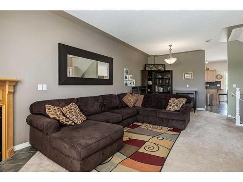 21 Country Hills Gardens Nw, Calgary, AB - Indoor Photo Showing Living Room With Fireplace