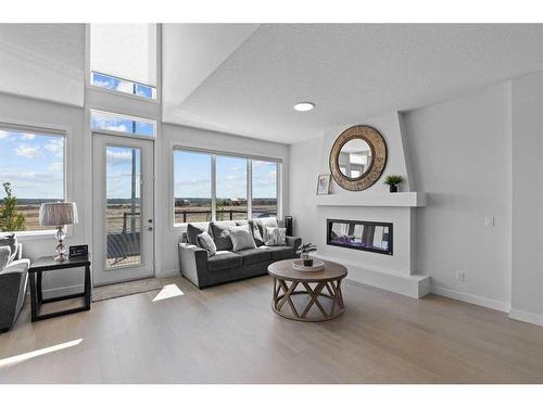 268 Seton Villas Se, Calgary, AB - Indoor Photo Showing Living Room With Fireplace