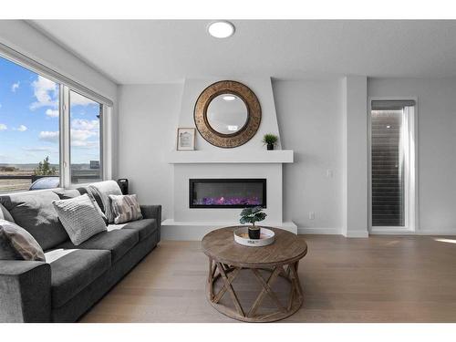 268 Seton Villas Se, Calgary, AB - Indoor Photo Showing Living Room With Fireplace