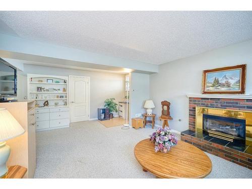 6711 Silverview Drive Nw, Calgary, AB - Indoor Photo Showing Living Room With Fireplace