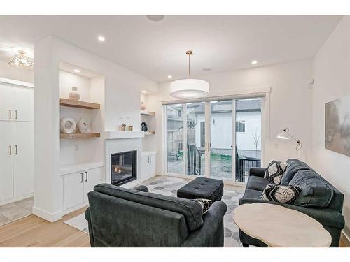 2010 41 Avenue Sw, Calgary, AB - Indoor Photo Showing Living Room With Fireplace