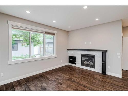 4324 70 Street Nw, Calgary, AB - Indoor Photo Showing Living Room With Fireplace