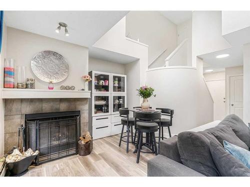 9-206 Village Terrace Sw, Calgary, AB - Indoor Photo Showing Living Room With Fireplace