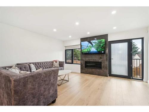 7232 Sierra Morena Boulevard Sw, Calgary, AB - Indoor Photo Showing Living Room With Fireplace