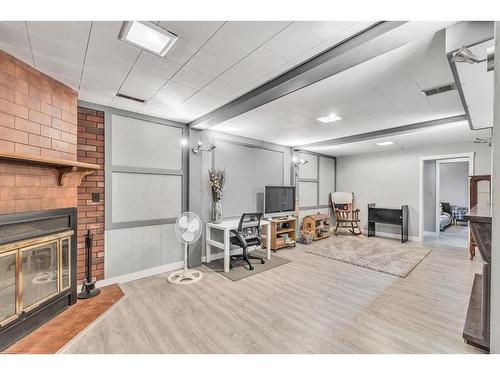 908 Olympia Crescent Se, Calgary, AB - Indoor With Fireplace