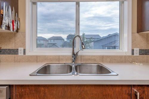 509 Mckenzie Towne Drive Se, Calgary, AB - Indoor Photo Showing Kitchen With Double Sink