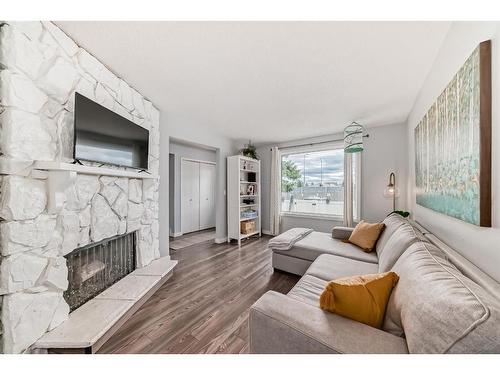 51-740 Bracewood Drive Sw, Calgary, AB - Indoor Photo Showing Living Room With Fireplace