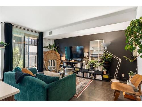 321-619 Confluence Way Se, Calgary, AB - Indoor Photo Showing Living Room