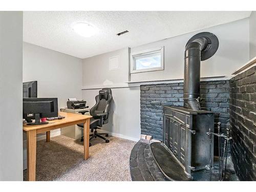 955 Midridge Drive Sw, Calgary, AB - Indoor Photo Showing Office With Fireplace