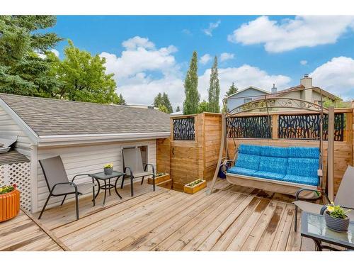 5111 32 Avenue Sw, Calgary, AB - Outdoor With Above Ground Pool With Deck Patio Veranda With Exterior