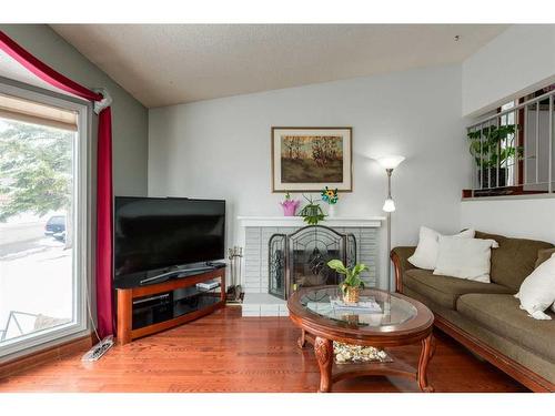 5111 32 Avenue Sw, Calgary, AB - Indoor Photo Showing Living Room With Fireplace