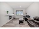 37 Legacy Glen Point Se, Calgary, AB  - Indoor Photo Showing Living Room With Fireplace 