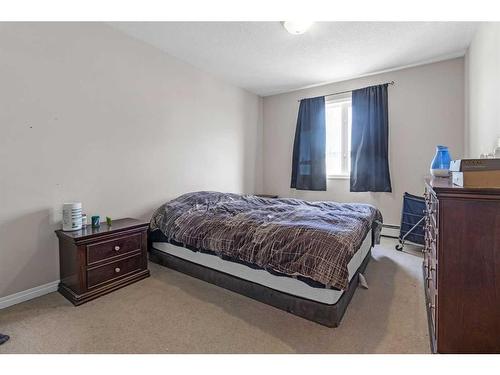 207-1010 Railway Street, Crossfield, AB - Indoor Photo Showing Bedroom