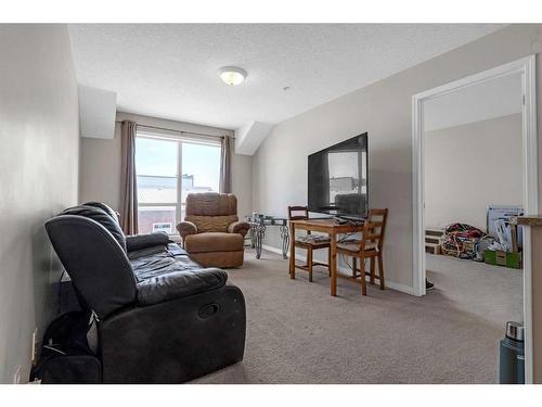 207-1010 Railway Street, Crossfield, AB - Indoor Photo Showing Living Room