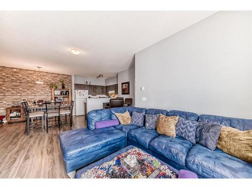 1414-1140 Taradale Drive Ne, Calgary, AB - Indoor Photo Showing Living Room