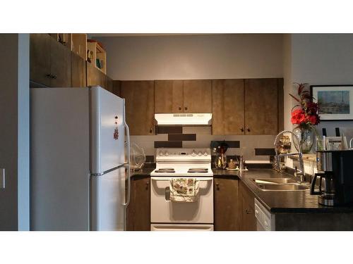 1414-1140 Taradale Drive Ne, Calgary, AB - Indoor Photo Showing Kitchen With Double Sink