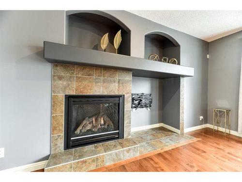 753 Auburn Bay Boulevard Se, Calgary, AB - Indoor Photo Showing Living Room With Fireplace