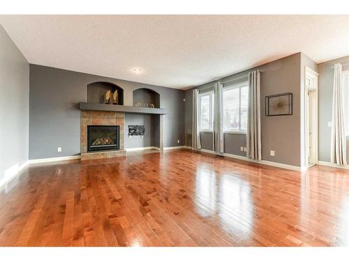 753 Auburn Bay Boulevard Se, Calgary, AB - Indoor Photo Showing Living Room With Fireplace