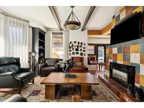 3219 Elbow Drive Sw, Calgary, AB - Indoor Photo Showing Living Room With Fireplace