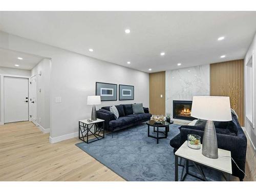 436 Woodbriar Place Sw, Calgary, AB - Indoor With Fireplace