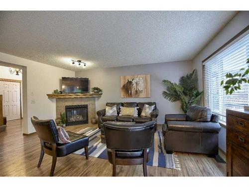 31 Cranfield Manor Se, Calgary, AB - Indoor Photo Showing Living Room With Fireplace