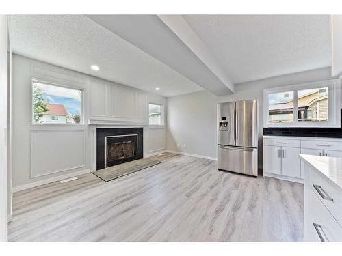 27 Erin Meadows Court Se, Calgary, AB - Indoor With Fireplace