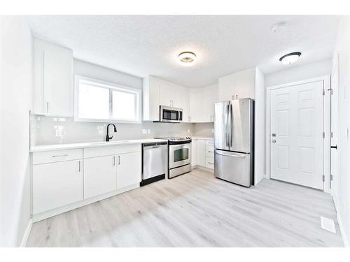 27 Erin Meadows Court Se, Calgary, AB - Indoor Photo Showing Kitchen With Stainless Steel Kitchen