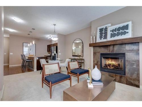 1303-155 Silverado Skies Link Sw, Calgary, AB - Indoor Photo Showing Living Room With Fireplace