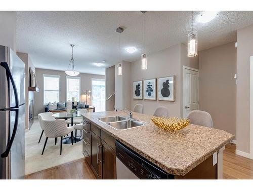 1303-155 Silverado Skies Link Sw, Calgary, AB - Indoor Photo Showing Kitchen With Stainless Steel Kitchen With Double Sink